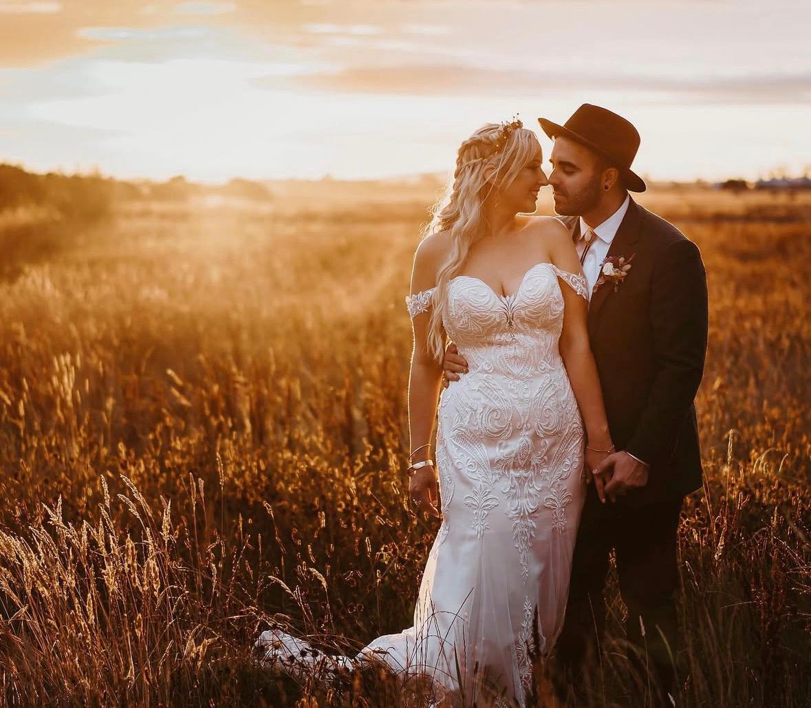 Couple at sunset in wheat field